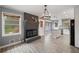 Modern kitchen featuring an open layout, center island, updated appliances, and stylish lighting at 4329 Cedar Valley Ln, Conley, GA 30288
