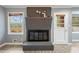 Cozy living area featuring a brick fireplace, natural light, and inviting ambiance at 4329 Cedar Valley Ln, Conley, GA 30288