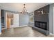 Inviting living space featuring a brick fireplace and open access to the updated kitchen at 4329 Cedar Valley Ln, Conley, GA 30288