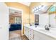 Bathroom vanity with double sinks and a door leading back to the bedroom at 7350 S Mitchell Ct, Villa Rica, GA 30180