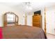 Bedroom featuring a four-poster bed, dresser, and doorway at 7350 S Mitchell Ct, Villa Rica, GA 30180