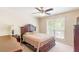 Bedroom with a bed, nightstand, dresser, ceiling fan, and a window at 7350 S Mitchell Ct, Villa Rica, GA 30180