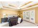 Bedroom with french doors leading to the outside with a ceiling fan at 7350 S Mitchell Ct, Villa Rica, GA 30180