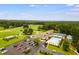 Community clubhouse with pool, tennis courts and golf course surrounded by mature trees at 7350 S Mitchell Ct, Villa Rica, GA 30180