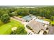 Aerial view featuring tennis courts, a pool, and clubhouse at 7350 S Mitchell Ct, Villa Rica, GA 30180