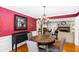 Elegant dining room features a chandelier, hardwood floors, and adjacent living area at 7350 S Mitchell Ct, Villa Rica, GA 30180