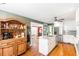 Well-equipped kitchen with stainless steel appliances and granite countertops connects to a dining area at 7350 S Mitchell Ct, Villa Rica, GA 30180