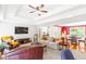 Spacious living room featuring tray ceilings, a fireplace, and an open floor plan at 7350 S Mitchell Ct, Villa Rica, GA 30180