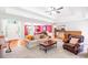 Bright living room with tray ceiling, fireplace, and open layout perfect for entertaining at 7350 S Mitchell Ct, Villa Rica, GA 30180