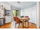 Cozy dining area with wood floors, table setting, and view to the outside deck at 1131 Hershey Dr, Marietta, GA 30062