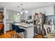Modern kitchen with granite countertops, a large island, and stainless steel appliances at 1131 Hershey Dr, Marietta, GA 30062