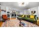 Open-plan living space with stylish furniture, leading to the kitchen and dining area at 1131 Hershey Dr, Marietta, GA 30062
