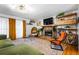 Cozy living room with a stone fireplace, unique seating, and stylish decor at 1131 Hershey Dr, Marietta, GA 30062