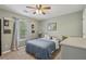 Serene bedroom featuring a comfortable bed, soft lighting, and a peaceful ambiance at 2277 Shady Maple Trl, Loganville, GA 30052