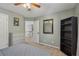Cozy bedroom with neutral tones, a bookshelf, and a well-lit atmosphere at 2277 Shady Maple Trl, Loganville, GA 30052