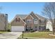 Lovely two-story home with stone facade, well-kept lawn, attached garage, and inviting curb appeal at 2277 Shady Maple Trl, Loganville, GA 30052