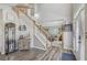 Inviting foyer with hardwood floors, a staircase, and a view of the living room at 2277 Shady Maple Trl, Loganville, GA 30052