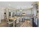 Kitchen featuring gray cabinets, stainless steel appliances and a breakfast table at 2277 Shady Maple Trl, Loganville, GA 30052