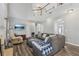 Open living room featuring high ceilings, a cozy fireplace, and abundant natural light at 2277 Shady Maple Trl, Loganville, GA 30052