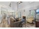 Spacious living room with a fireplace, high ceilings, hardwood floors, and open to the kitchen at 2277 Shady Maple Trl, Loganville, GA 30052