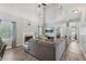 Bright living room with a fireplace, vaulted ceilings, and large windows at 2277 Shady Maple Trl, Loganville, GA 30052