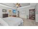 This main bedroom has neutral paint, ceiling fan, carpet flooring, and ensuite access at 2277 Shady Maple Trl, Loganville, GA 30052