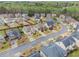 Overhead view of a neighborhood with well-kept lawns, mature trees, and attractive houses, creating a welcoming atmosphere at 2620 Paddock Point Pl, Dacula, GA 30019
