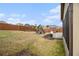 Landscaped backyard with a playground, patio and wood fence at 2620 Paddock Point Pl, Dacula, GA 30019