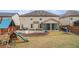 Large backyard with playground, patio area and established landscaping at 2620 Paddock Point Pl, Dacula, GA 30019