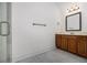 Bathroom featuring tile floors, vanity with storage and modern fixtures at 2620 Paddock Point Pl, Dacula, GA 30019