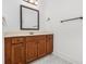 Bathroom featuring tile floors, vanity with storage, a mirror, and modern lighting at 2620 Paddock Point Pl, Dacula, GA 30019