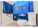 Bathroom featuring a toilet and a blue curtain with nautical elements at 2620 Paddock Point Pl, Dacula, GA 30019