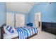 Brightly painted bedroom with large closet, carpet floors, and natural light at 2620 Paddock Point Pl, Dacula, GA 30019