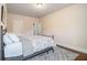 Bedroom featuring hardwood floors and an iron bed frame at 2620 Paddock Point Pl, Dacula, GA 30019