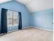 Bedroom with a large window, and blue accent wall at 2620 Paddock Point Pl, Dacula, GA 30019