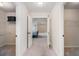 Hallway view between walk-in closets leading to a bedroom at 2620 Paddock Point Pl, Dacula, GA 30019