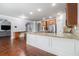 Open kitchen features hardwood floors, granite countertops, stainless appliances, and ample cabinetry at 2620 Paddock Point Pl, Dacula, GA 30019