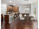 Eat-in kitchen with wood cabinetry, stainless appliances, granite countertops and seating at the island at 2620 Paddock Point Pl, Dacula, GA 30019