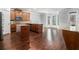 Open kitchen with hardwood floors, granite countertops, stainless steel appliances, and ample cabinets at 2620 Paddock Point Pl, Dacula, GA 30019