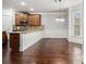 Open kitchen area with hardwood floors, a breakfast nook, and a granite countertop at 2620 Paddock Point Pl, Dacula, GA 30019