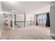 Loft area featuring neutral carpet, natural light, and railing overlooking the main floor at 2620 Paddock Point Pl, Dacula, GA 30019
