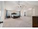 Spacious main bedroom with a ceiling fan, neutral colors and large windows at 2620 Paddock Point Pl, Dacula, GA 30019