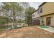 Backyard featuring a small patio, putting green, and pond views at 4125 Madison Bridge Dr, Suwanee, GA 30024