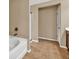 Bathroom featuring a bathtub, shower with glass enclosure and a separate commode at 4125 Madison Bridge Dr, Suwanee, GA 30024