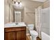 Bathroom featuring a wood vanity, white sink, and a shower with white tile and shower curtain at 4125 Madison Bridge Dr, Suwanee, GA 30024