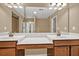 Bathroom showcasing a double vanity, framed mirror, and recessed lighting at 4125 Madison Bridge Dr, Suwanee, GA 30024