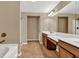 Bathroom with double vanity, tile floors, shower with glass door, and a bathtub at 4125 Madison Bridge Dr, Suwanee, GA 30024