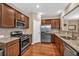 Modern kitchen with stainless steel appliances, granite countertops, and ample cabinet space at 4125 Madison Bridge Dr, Suwanee, GA 30024