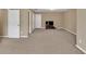 Living room featuring carpet floors, neutral walls and natural lighting at 4125 Madison Bridge Dr, Suwanee, GA 30024