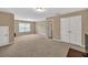 Living room with carpet floors, neutral walls, and lots of natural light at 4125 Madison Bridge Dr, Suwanee, GA 30024